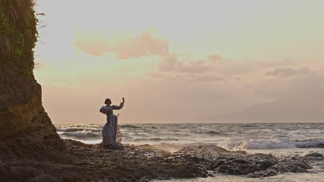 Woman Dancing With Waves Splashing