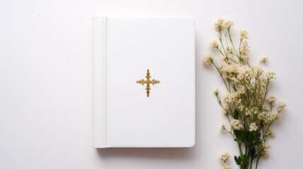 A white bible on a white wooden table with  flowers. Christian Mockup, background for publications, presentations, advertisements, quotes