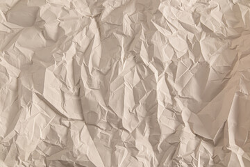 The texture of the crumpled paper is light brown. abstract paper background. A copy of the space. layout, blank template.