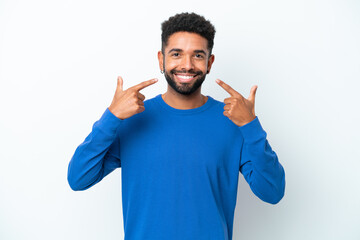 Young Brazilian man isolated on white background giving a thumbs up gesture