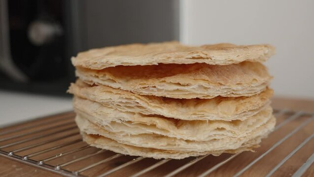Baked layers of puff pastry, a preparation for Napoleon cake.