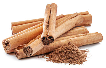 Cinnamon dried bark strips and cinnamon powder, sweet-smelling brown substance used in cooking, isolated on white background.