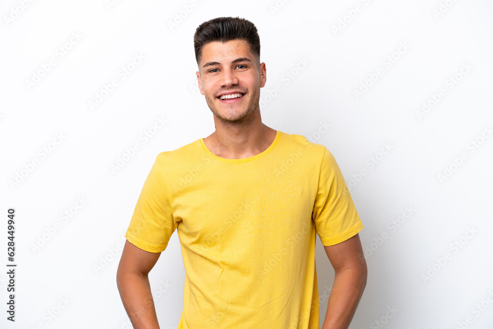 Wall mural Young caucasian man isolated on white background laughing