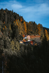 Fototapeta na wymiar Houses on a mountain during sunset in Santa Magdalena Dolomites Tyrol Italy