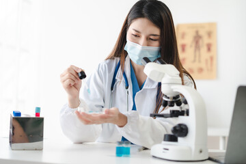 Science and medicine, scientist analyzing and dropping a sample into a glassware, experiments...