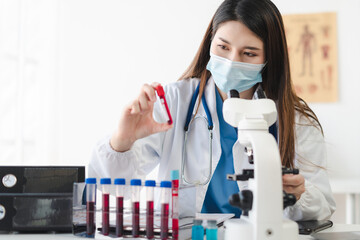 Lab work, Doctor holds a test tube takes the test from a test tube in analysis, blood, DNA, test tube stand.