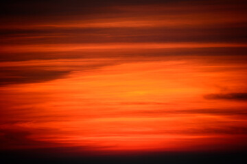 At dusk, orange sky and black clouds. Abstract background. View of the urban landscape from Dajianshan Mountain, New Taipei City.