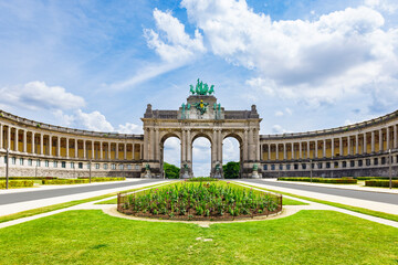 The Cinquantenaire Memorial Arcade in the centre of the Parc du Cinquantenaire, Brussels, Belgium with the text "This monument was erected in 1905 for the glorification of the independence of Belgium" - Powered by Adobe
