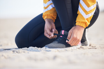 Beach, closeup and woman tie laces for an outdoor run for fitness, health and wellness by seaside....