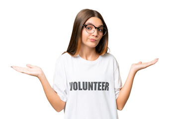 Teenager volunteer caucasian girl over isolated background having doubts while raising hands