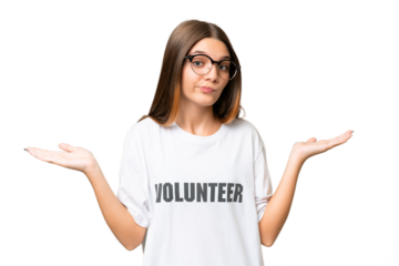 Teenager volunteer caucasian girl over isolated background having doubts while raising hands