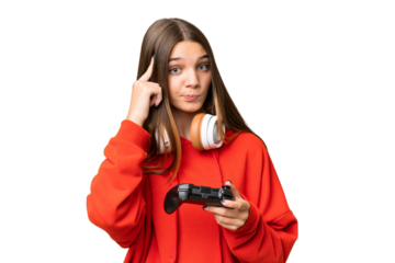 Teenager caucasian girl playing with a video game controller over isolated background thinking an idea