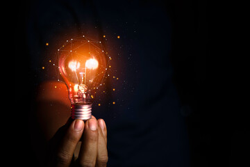 innovation ideas for success. Light bulb in businessman hand representing modern ideas and technology. Innovations and technologies that rely on information from the Internet, Big Data.