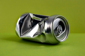 Aluminum crushed can for beverage. Still-life picture of a single metallic container isolated on...