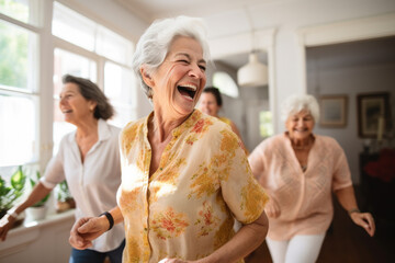 Group of happy active senior women laughing and dancing at home.