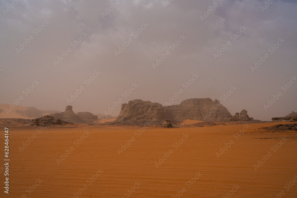 Sticker iew in the Sahara desert of Tadrart rouge tassili najer in Djanet City  ,Algeria.colorful orange sand, rocky mountains