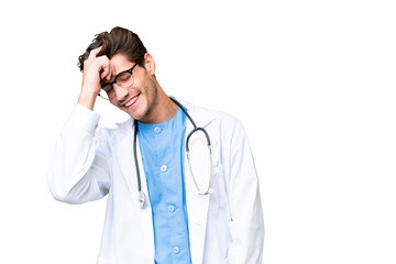 Young doctor man over isolated background laughing