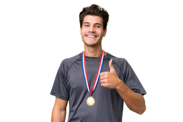 Young caucasian man with medals over isolated background giving a thumbs up gesture