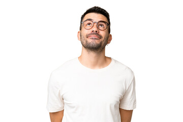 Obraz premium Young handsome caucasian man over isolated chroma key background and looking up