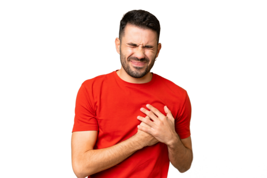 Young handsome caucasian man over isolated chroma key background having a pain in the heart