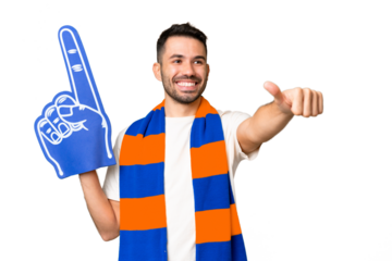 Young caucasian sports fan man over isolated chroma key background giving a thumbs up gesture