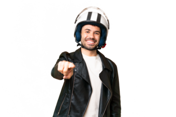 Young caucasian man with a motorcycle helmet over isolated chroma key background pointing front with happy expression