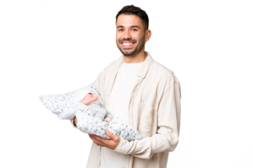 Young caucasian father with her newborn baby over isolated background smiling a lot