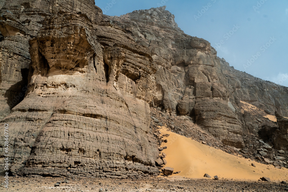 Poster iew in the Sahara desert of Tadrart rouge tassili najer in Djanet City  ,Algeria.colorful orange sand, rocky mountains