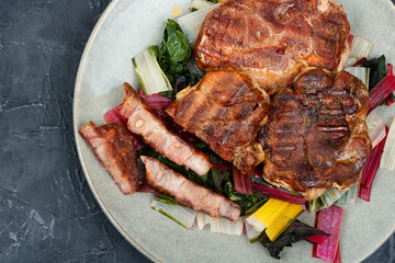 Meat steak with green salad.