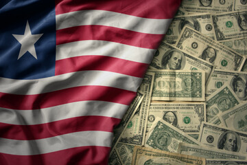 colorful waving national flag of liberia on a american dollar money background. finance concept