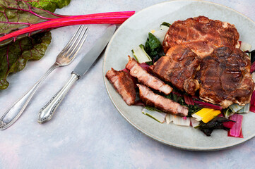 Tasty meat steak with green salad.