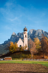 Bright photo of St. Constantine church in Dolomites, Trentino Alto Adige Italy