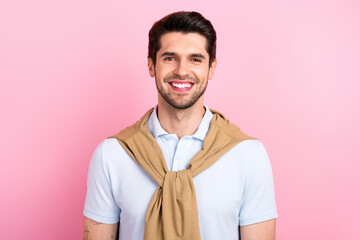 Portrait of satisfied positive young man beaming smile good mood hang shoulders sweater isolated on pink color background