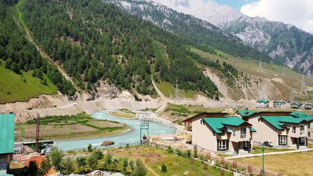 Houses at landscape blue sky mountains forests water roads and greenery in beautiful destination of kashmir.