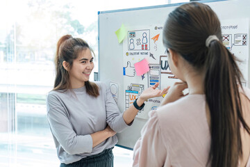 Asian office team brainstorming, plan for solution idea, Group of asia creative teamwork and woman leader at business meeting for developing mobile phone app, ux, ui start up, small business