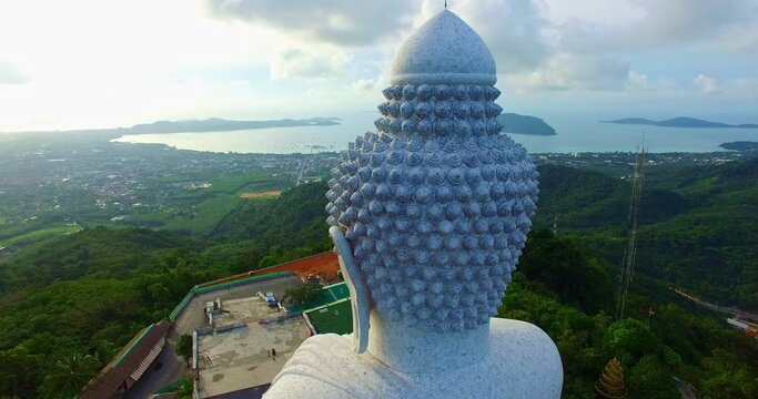 .aerial view Phuket Big Buddha is one of the island most important and revered landmarks in Phuket 360 degree view on Phuket big Buddha viewpoint. .blue sky blue sea and green forest background..