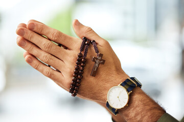 Christian man, rosary and hands praying for spiritual faith, holy gospel or worship God at church....