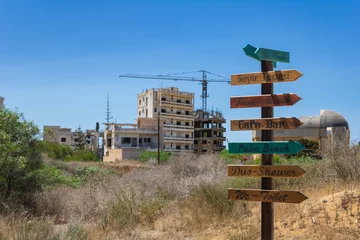 Gordijnen Beach signpost in Varosha, the southern quarter of Famagusta, ghost town under control of the United Nations, Northern Cyprus, Turkish side of the island © Blazenka