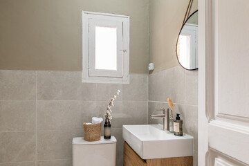 Contemporary bathroom interior with modern fixtures and mirror reflection