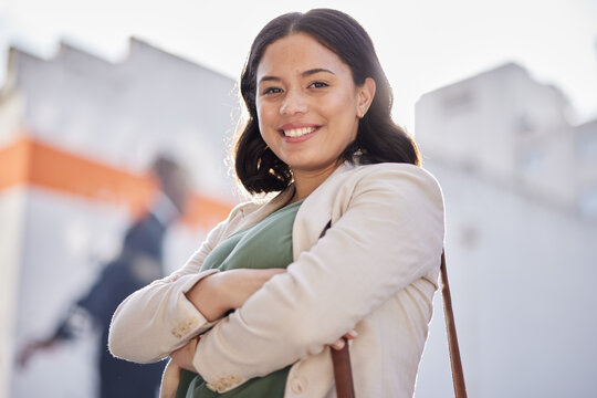 Business woman, arms crossed and portrait outdoor in city with travel and smile. Urban, face and female professional with bag for career and commute to work feeling happy and proud from confidence