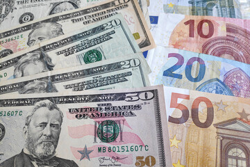 Fototapeta na wymiar Stack of US Dollar and Euros