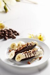 Delightful Banana Halves Covered with Chocolate and Almond Sprinkles