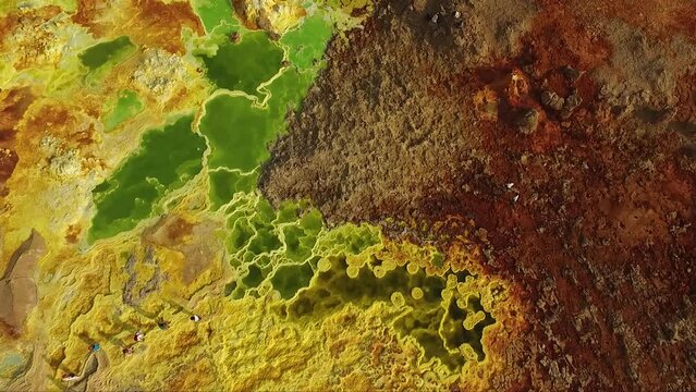 Journey to the Danakil Desert, Ethiopia. The colorful landscape of Dallol lake in Crater of Volcano. Sulphur springs. Hottest place on the Earth. Acid lake, Danakil desert by drone.