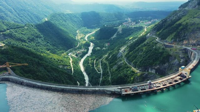 Inguri hydroelectric power plant in Georgia. Aerial view from drone of huge water dam. Hydropower energy station on Inguri River.