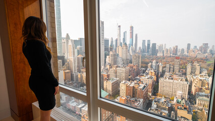 Woman looking at New York City architecture