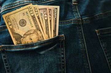 Banknotes of American dollars in pocket of jeans