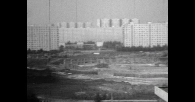 Residential buildings architecture panorama in urban district. Apartment building in city street. Real estate development. Archival vintage black white film. Old retro archive. 1980s Moscow, Russia