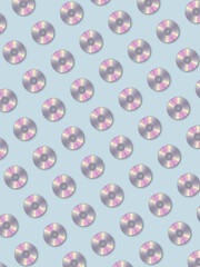 CD disk seamless pattern on background. Laser chaotic discs in neon holographic colors repeat background. Fashion wallpaper for web design, textile prints, posters, banners.