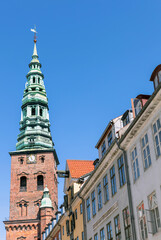 Downtown Copenhagen with old houses and church.