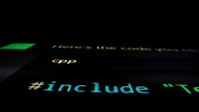 Closeup macro shot movement of coding script moving across LED screen with real-time AI-generated typing, showcasing advanced AI learning in optimization, debug and coding for software development.